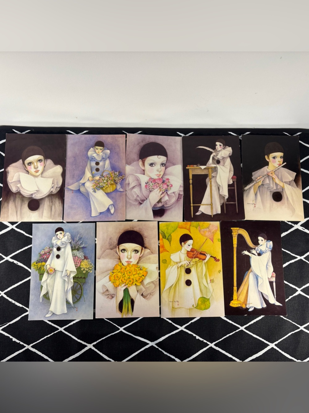 Beautiful set of 7 vintage Pierrot Baby Love postcards featuring colorful Pierr